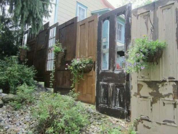 A yard FENCE made out of DOORS